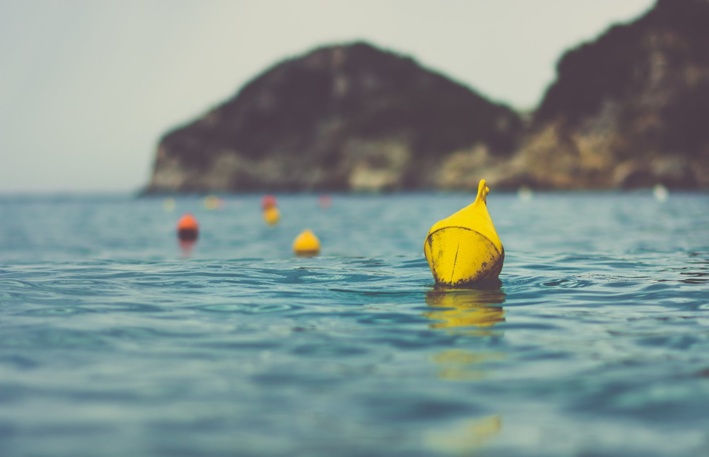 Colourful buoys on a calm sea