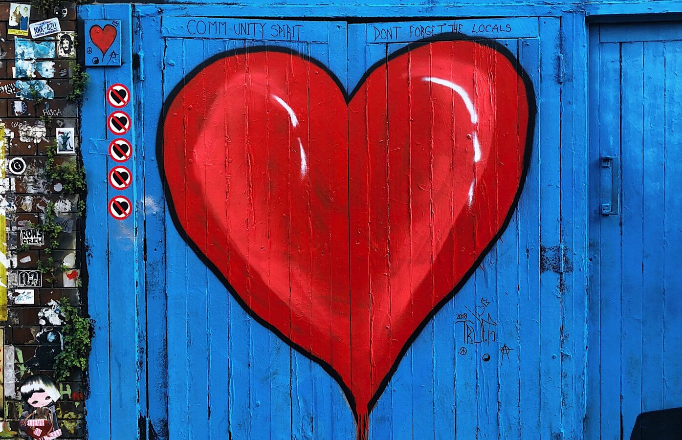 Heart graffiti on wooden door background