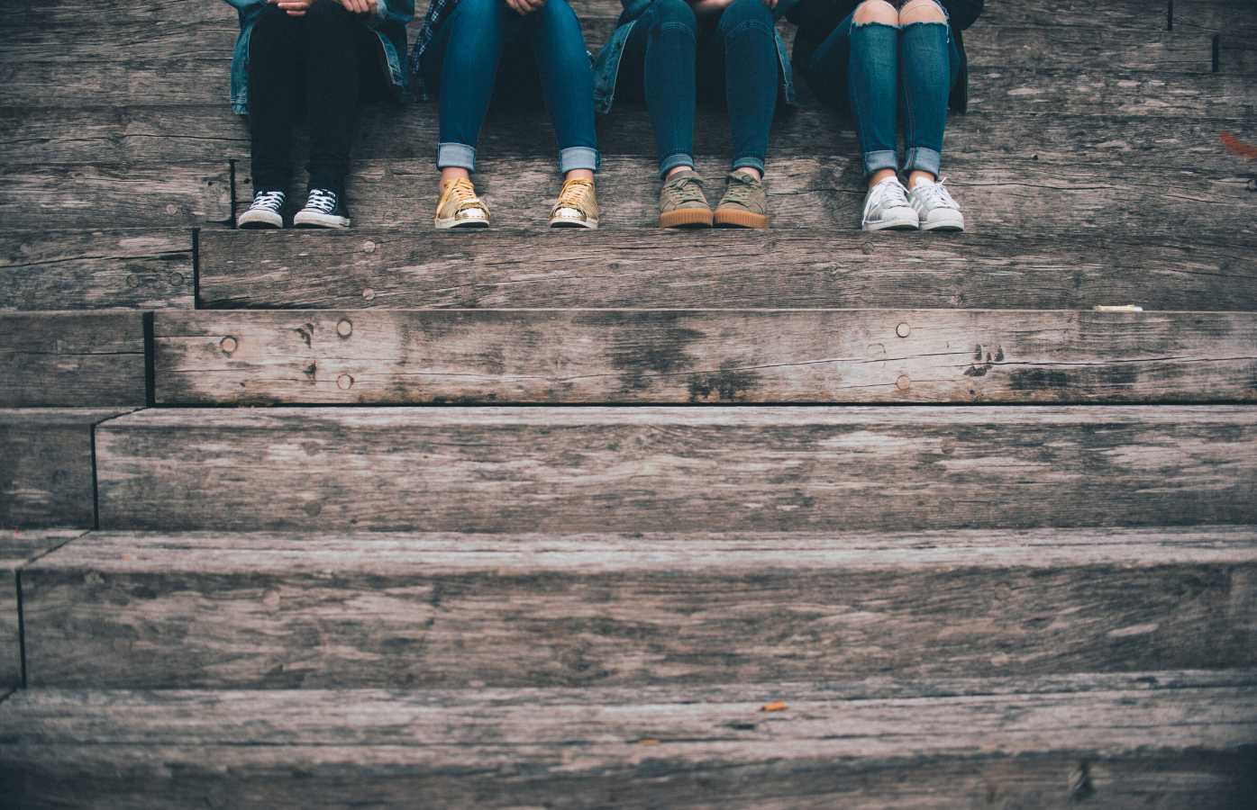 Young people sat on steps